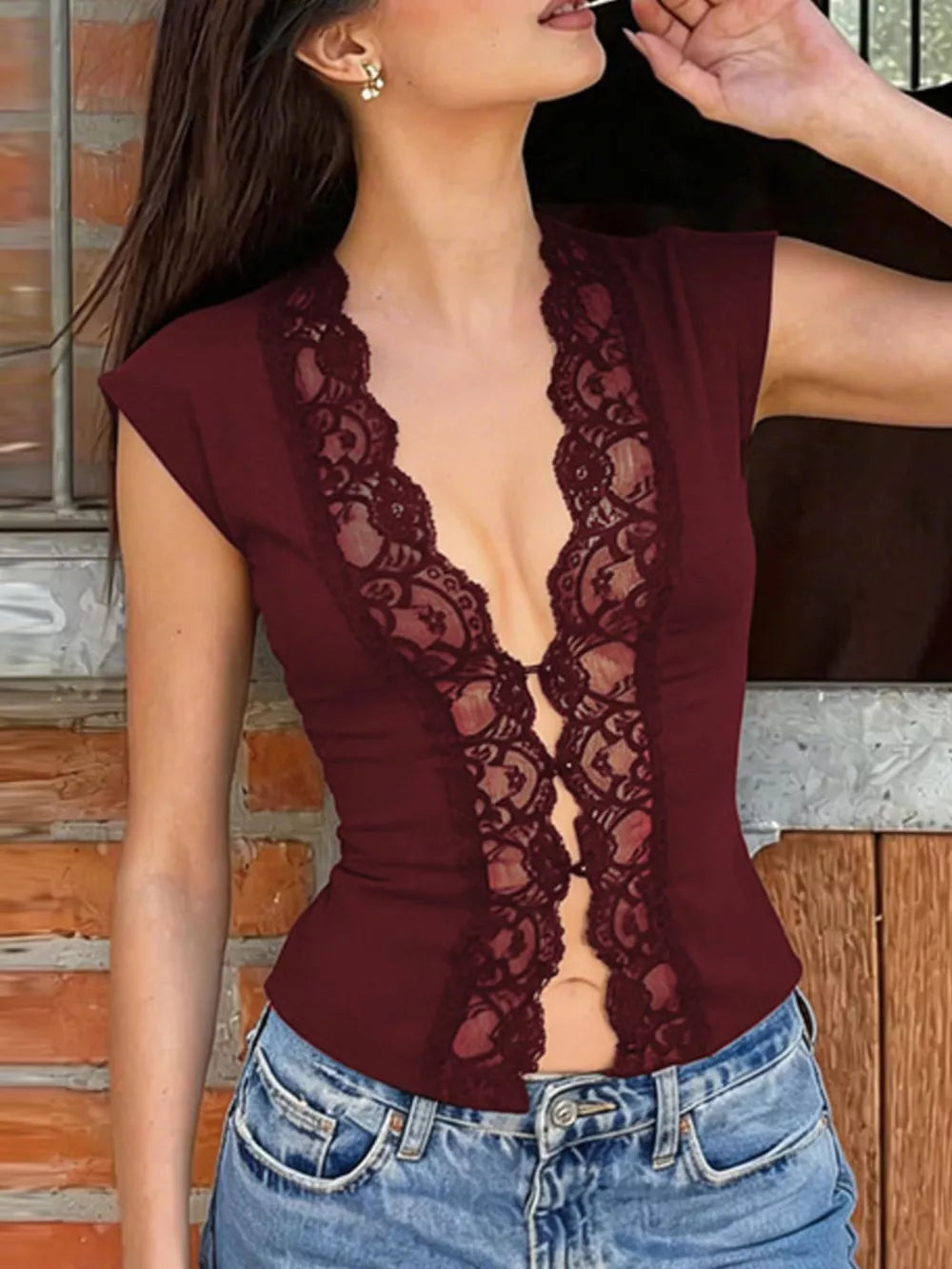 Wine red sheer vest with lace trim and button details, cropped style.
