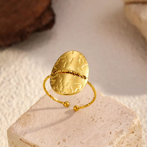 ring in gold with hammered texture and hammered texture