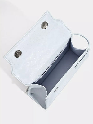 Chic mini pu leather tote in blue with buckle detail and patterned interior.