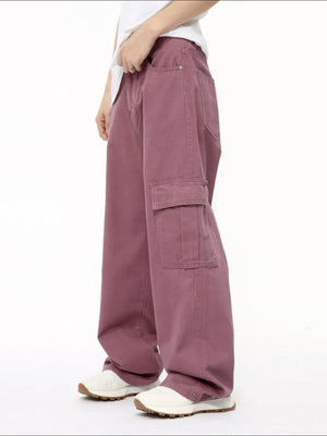 Oversized cargo denim trousers in Dusty Pink with a prominent side cargo pocket.