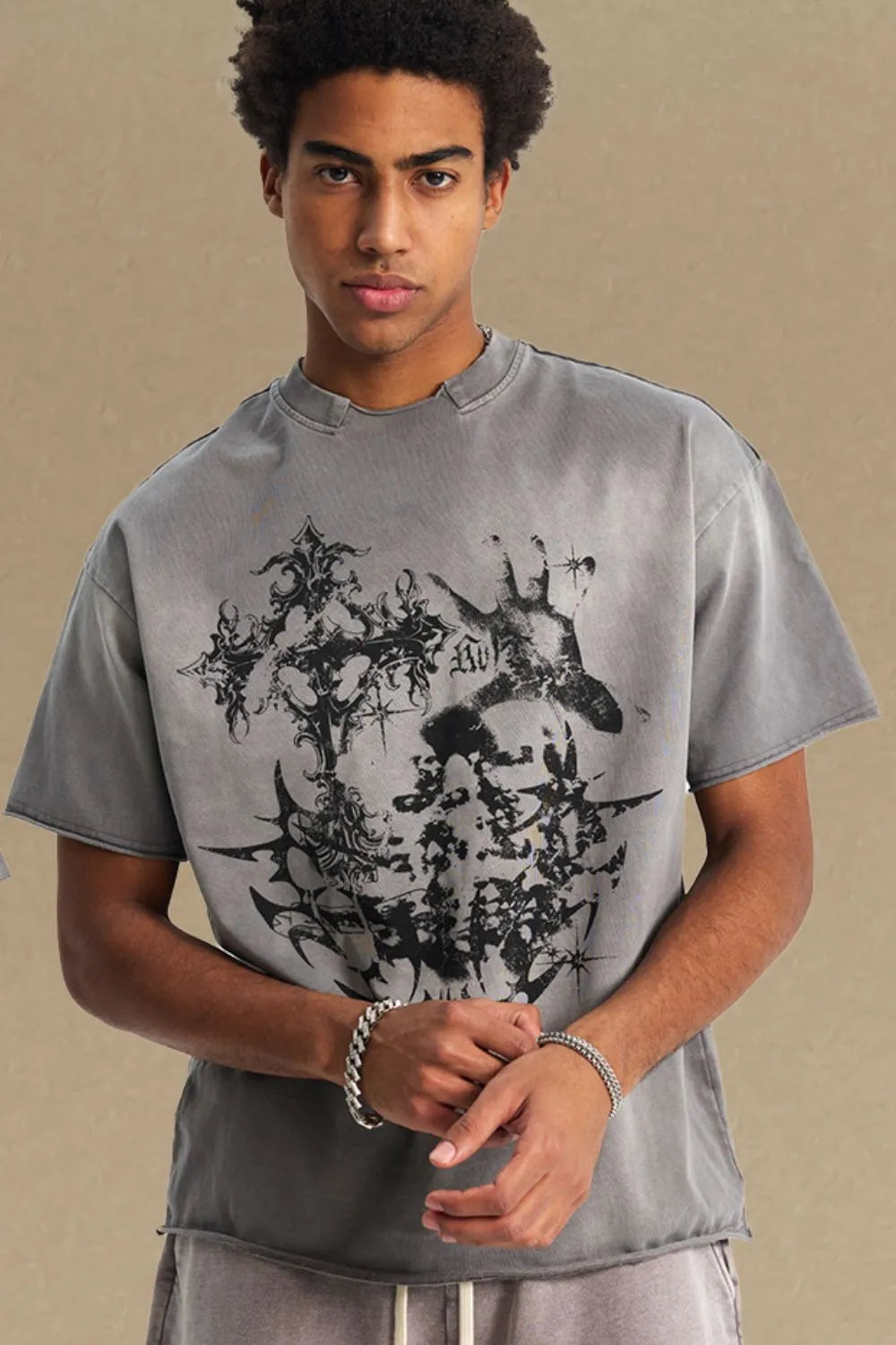 Gray distressed graphic tee with raw hem and abstract black print.