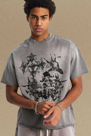 Gray distressed graphic tee with raw hem and abstract black print.
