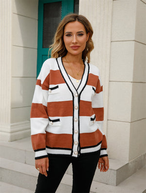 Striped knit cardigan with pearl buttons and contrast trim, in ochre and white.