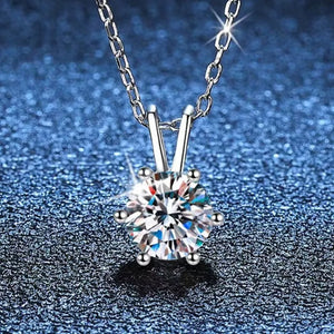 Elegant moissanite pendant in sterling silver with a delicate chain.