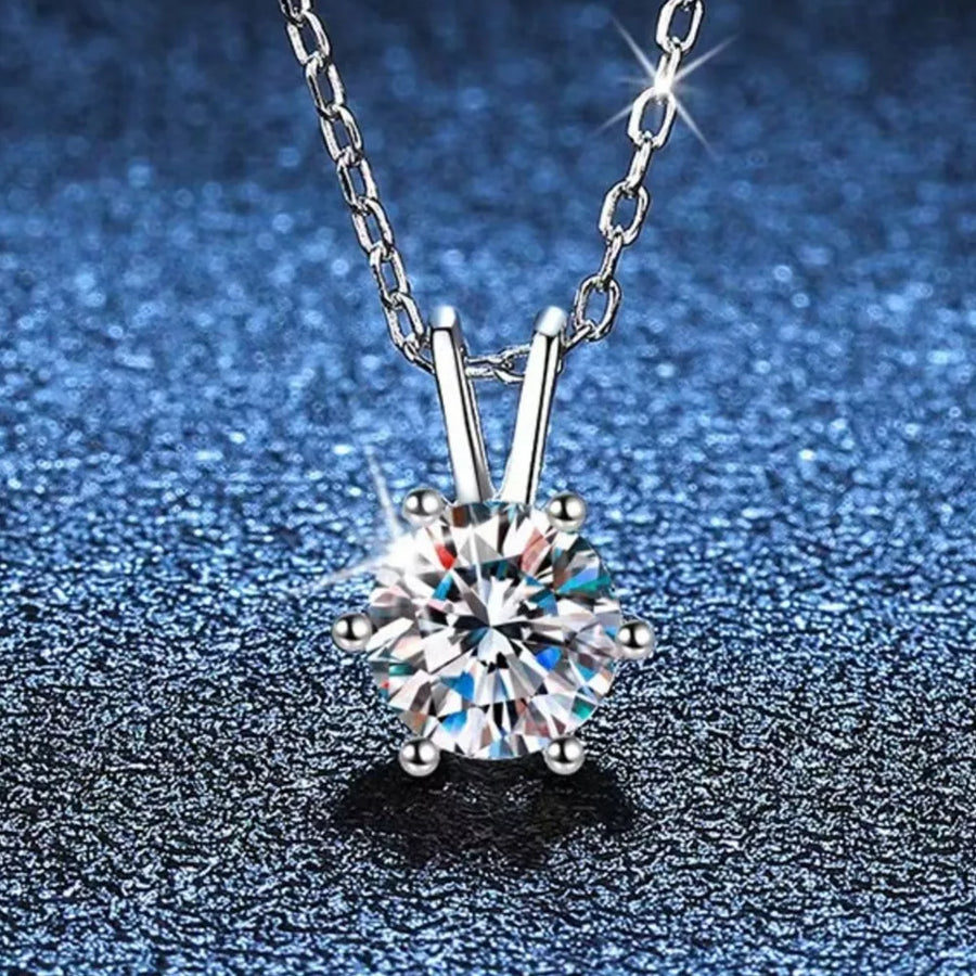 Elegant moissanite pendant in sterling silver with a delicate chain.