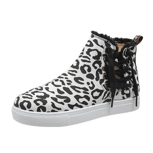 Canvas leopard print sneaker booties with lace-up detail and frayed trim.