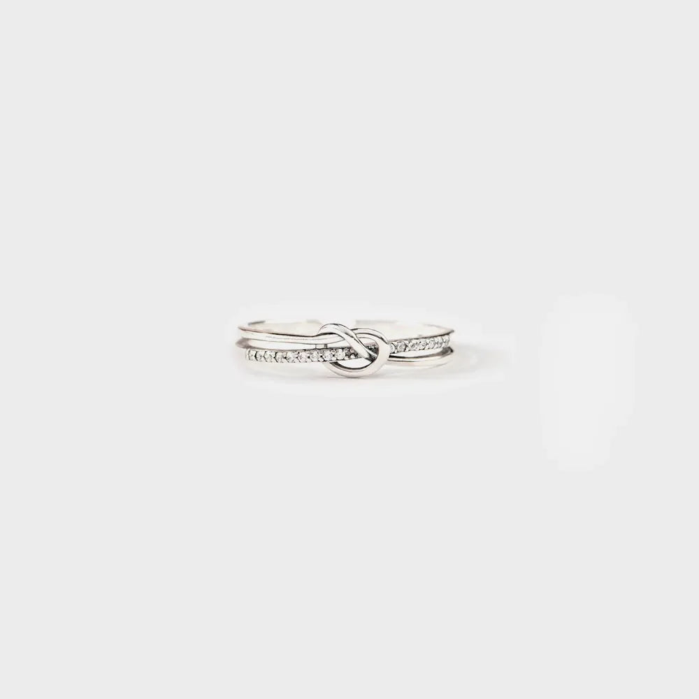 Silver pavé knot ring with double band detail