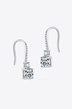 Silver moissanite drop earrings with a cascade of sparkling stones and a large center stone.