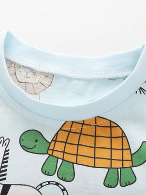 Light blue baby t-shirt with cartoon turtle and lion print
