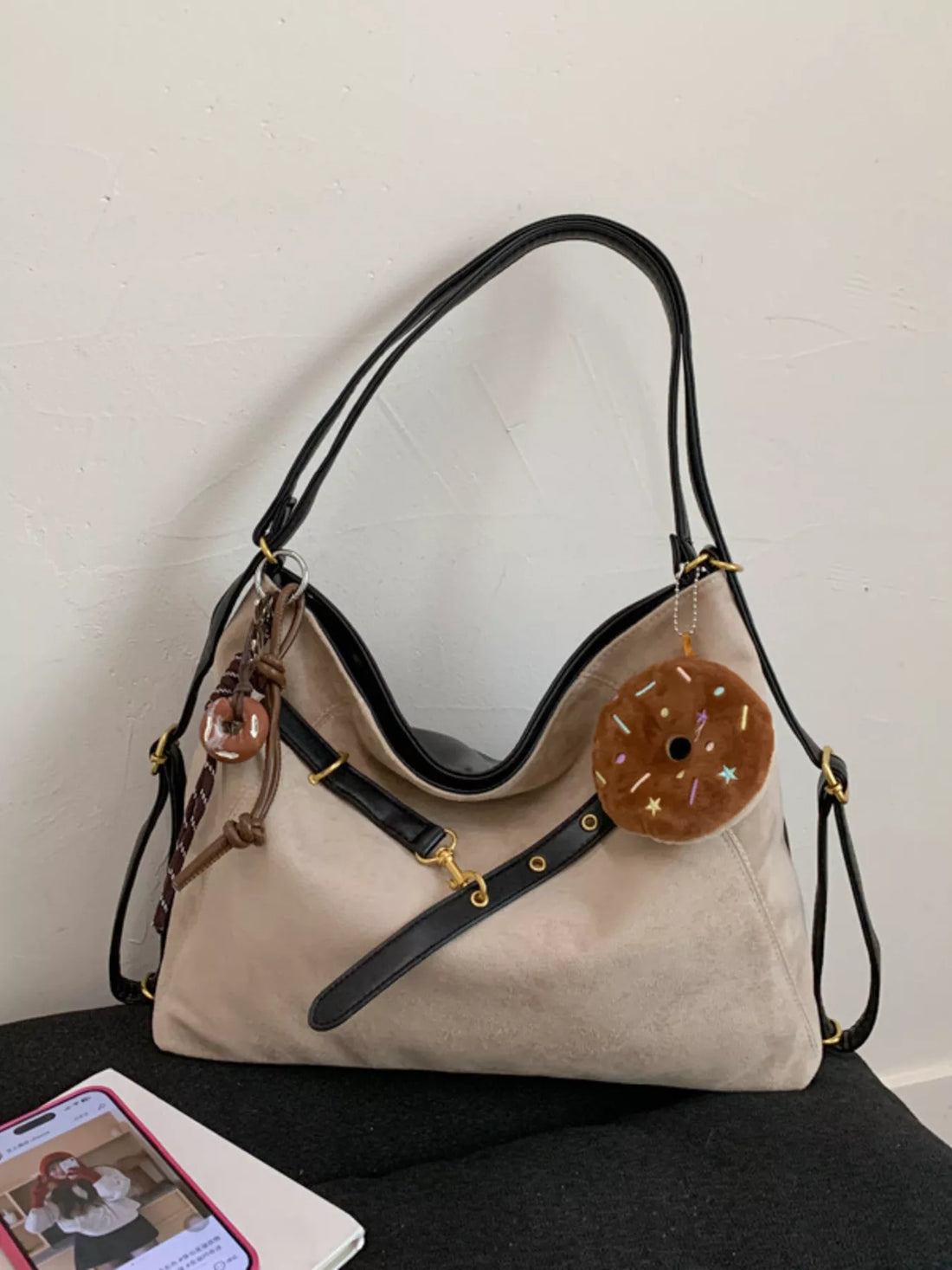 Chic Khaki hobo bag with adjustable strap and donut charm accessory