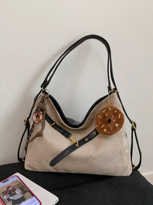 Chic Khaki hobo bag with adjustable strap and donut charm accessory