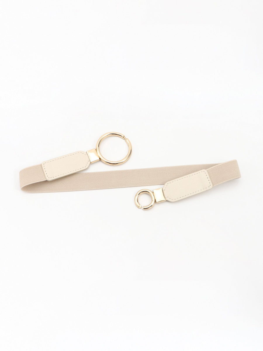 Interlocked ring elastic waist belt in tan with gold hardware and faux leather accents.