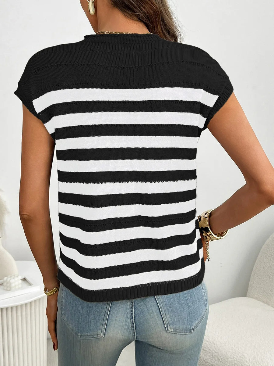 Black and white striped knit t-shirt with short sleeves and a pocket detail.