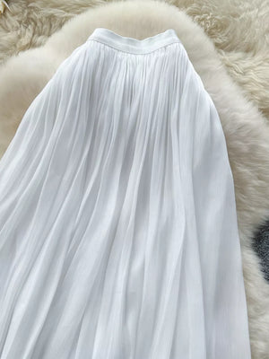 White pleated maxi skirt with a flowy, elegant cut.