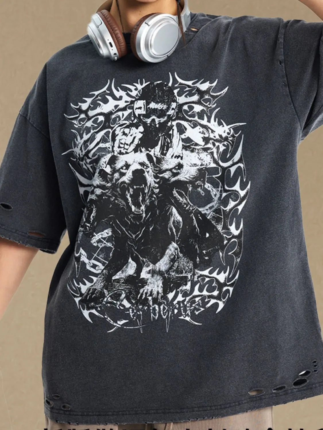 Black distressed oversized graphic tee with ripped details and a skull and wolf print.