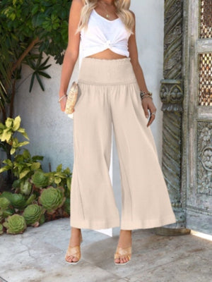 Smocked waist wide-leg pants in Light Brown with a textured fabric and ankle-length cut.