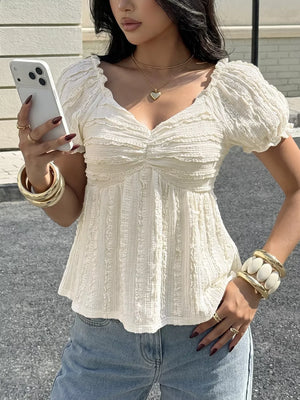 White textured maternity t-shirt with ruched sweetheart neckline and puff sleeves