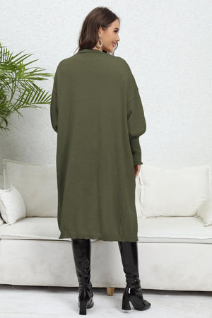Army green oversized knit cardigan with pockets, long sleeves, and a relaxed fit.