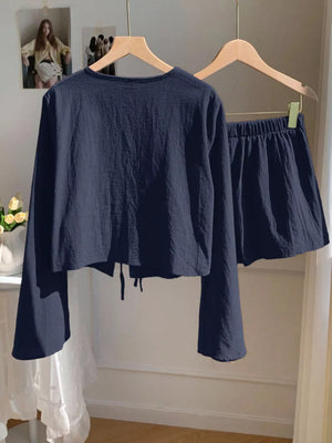 Navy tie-front top with bell sleeves and matching elastic waist shorts set