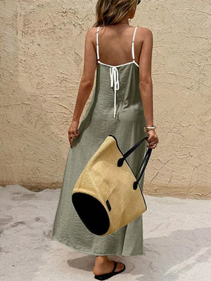 Olive spaghetti strap maxi dress with white contrasting trim and tie back.