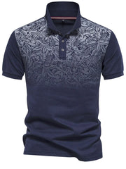 Navy polo shirt with floral ombre pattern on chest and sleeves, short sleeves, button neck.