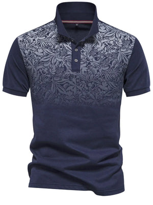 Navy polo shirt with floral ombre pattern on chest and sleeves, short sleeves, button neck.