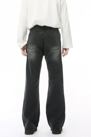 Dark wash wide leg jeans with back pockets and a faded look.