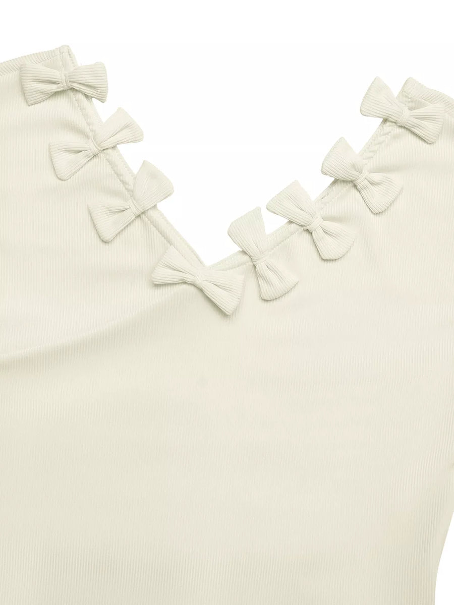 Ribbed knit V-neck t-shirt in cream with decorative bow details along the neckline.