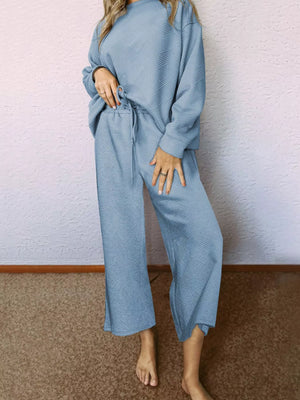 Light blue textured drawstring two-piece set with wide leg pants and crew neck top