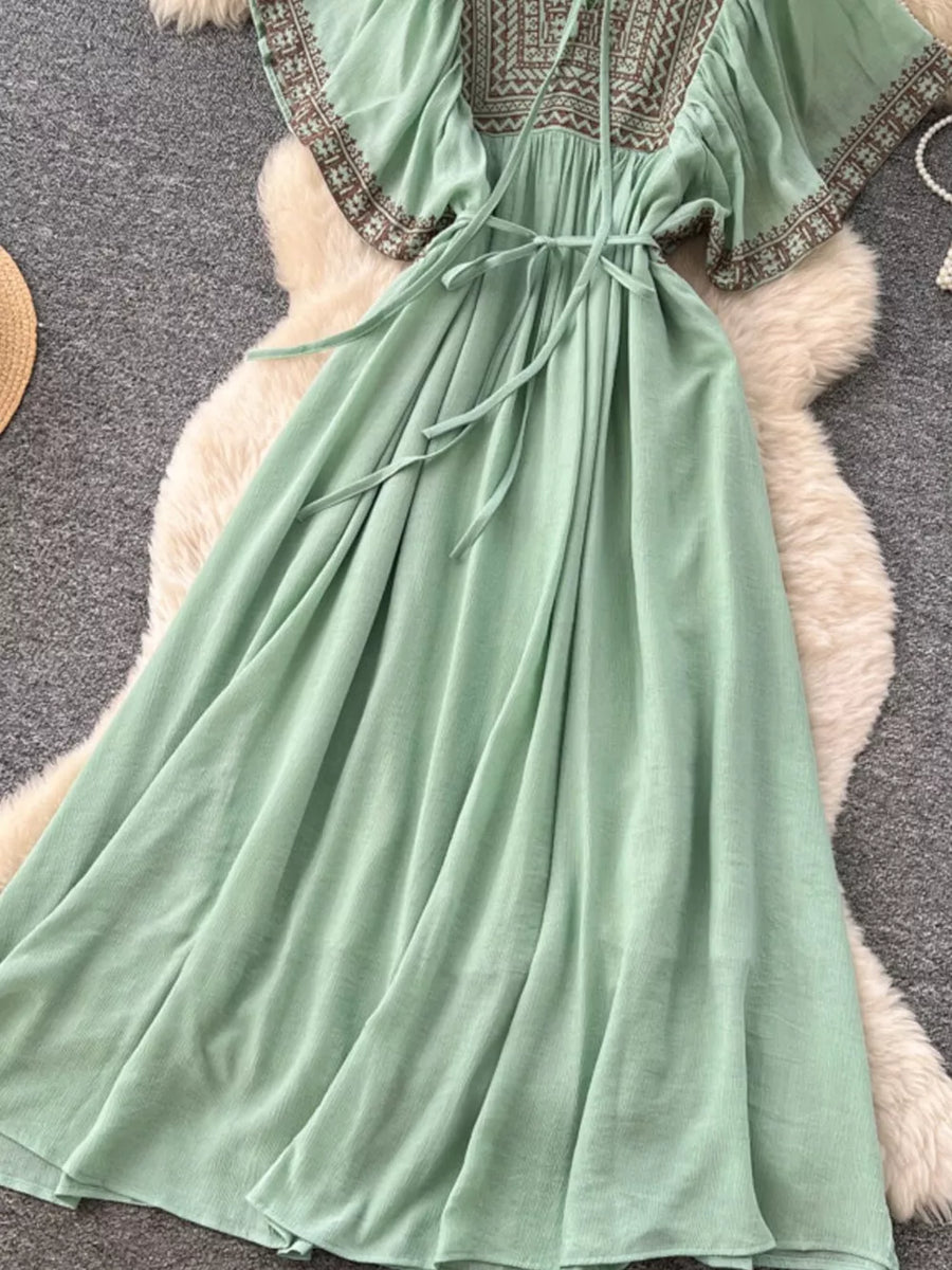 Mint green V-neck maxi dress with embroidered yoke and sleeves, tie waist.