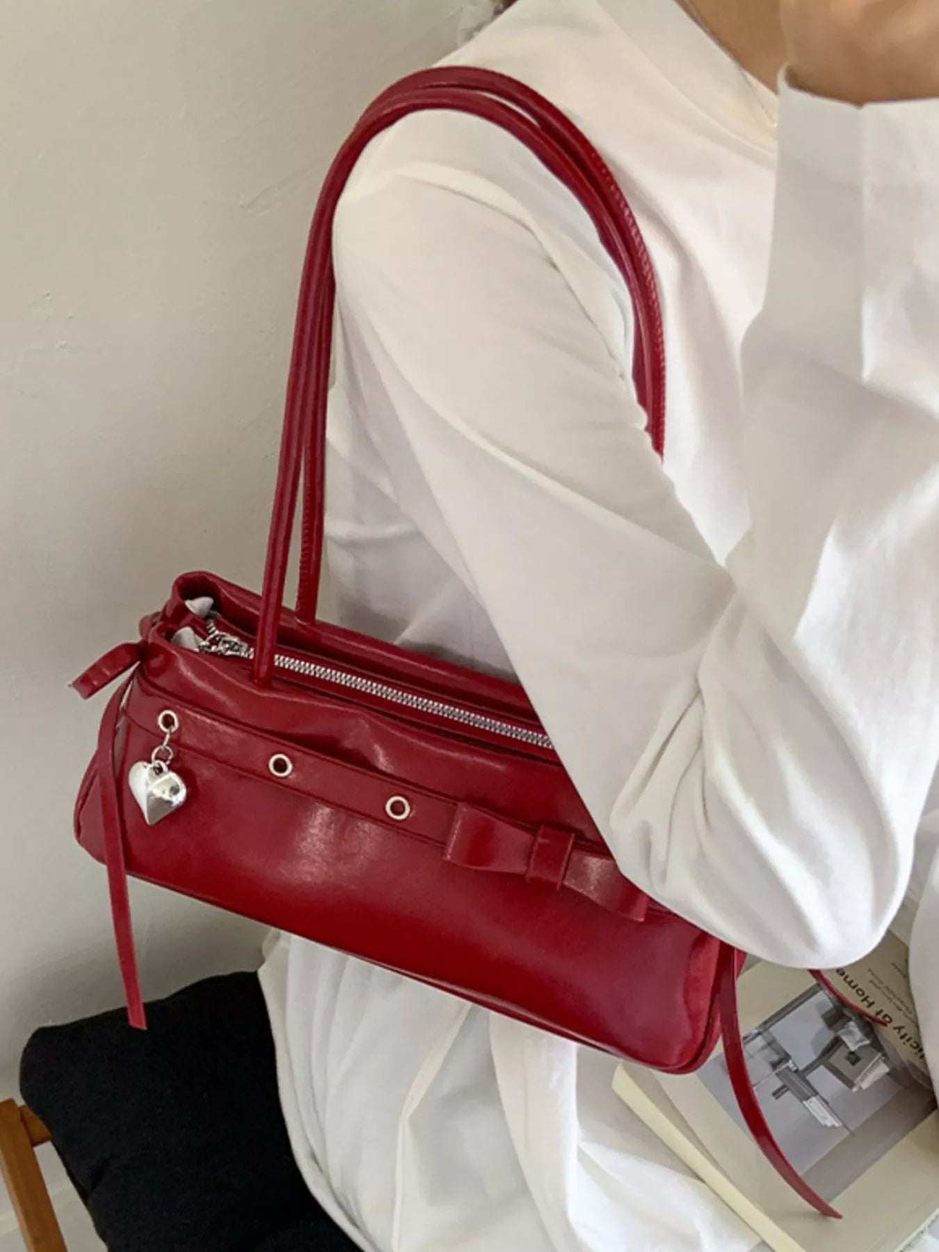 Red PU leather shoulder bag with silver heart charm and bow detail