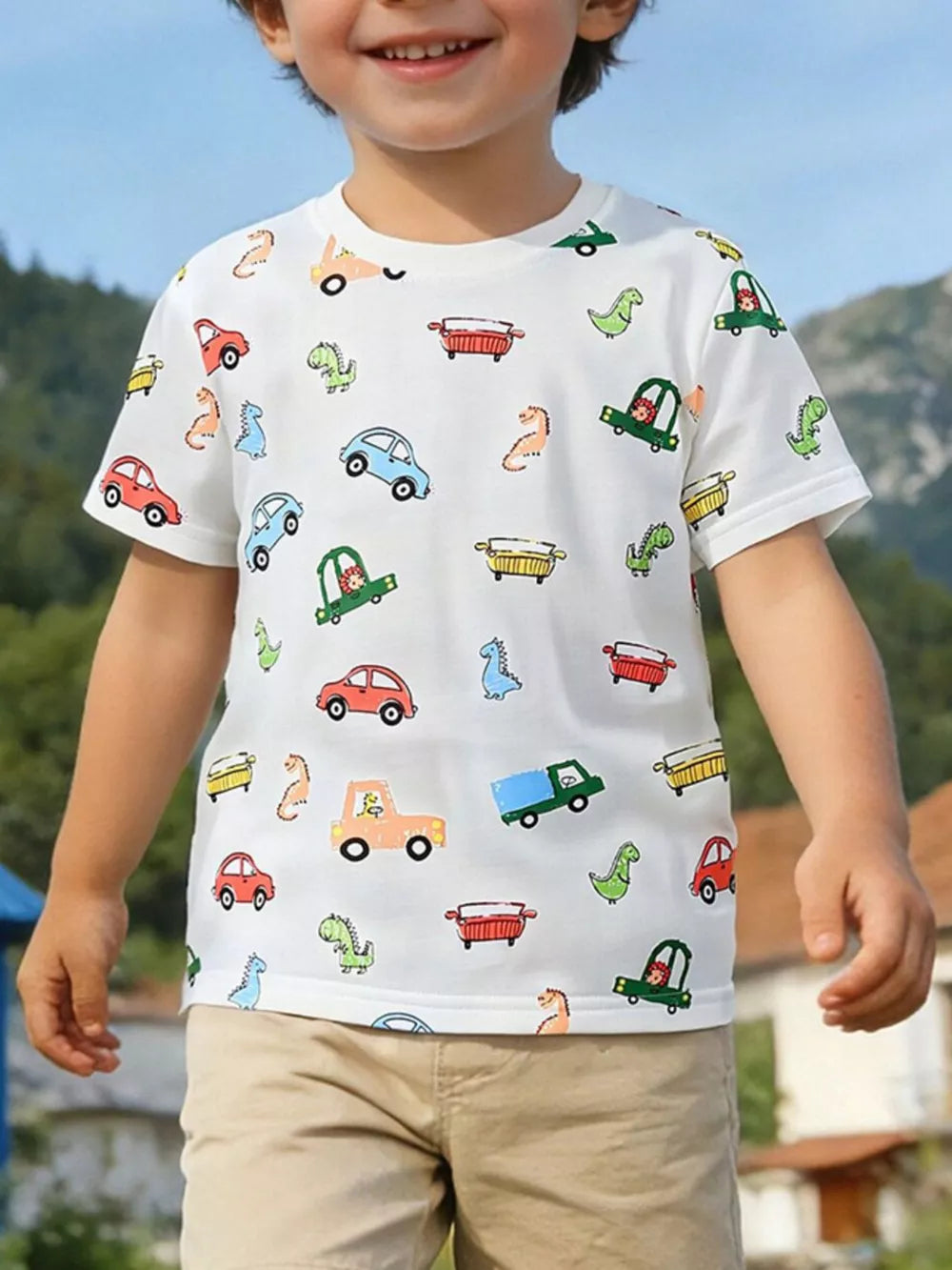 White cotton t-shirt for kids with a fun cartoon car and dinosaur print.