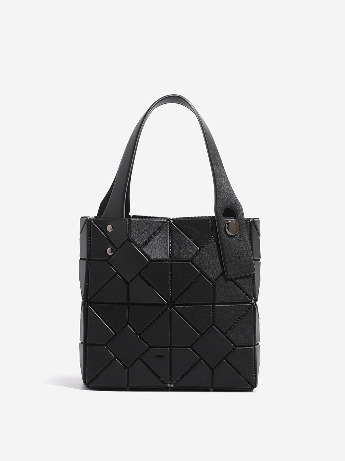 handbag in black featuring geometric panels and boxy fit