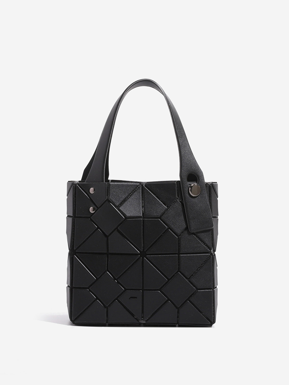 handbag in black featuring geometric panels and boxy fit