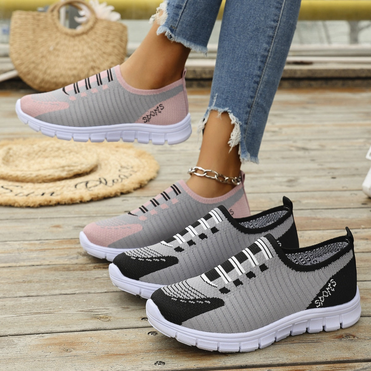 Mesh slip-on sneakers in gray with pink and black accents, round toe, comfortable casual style.