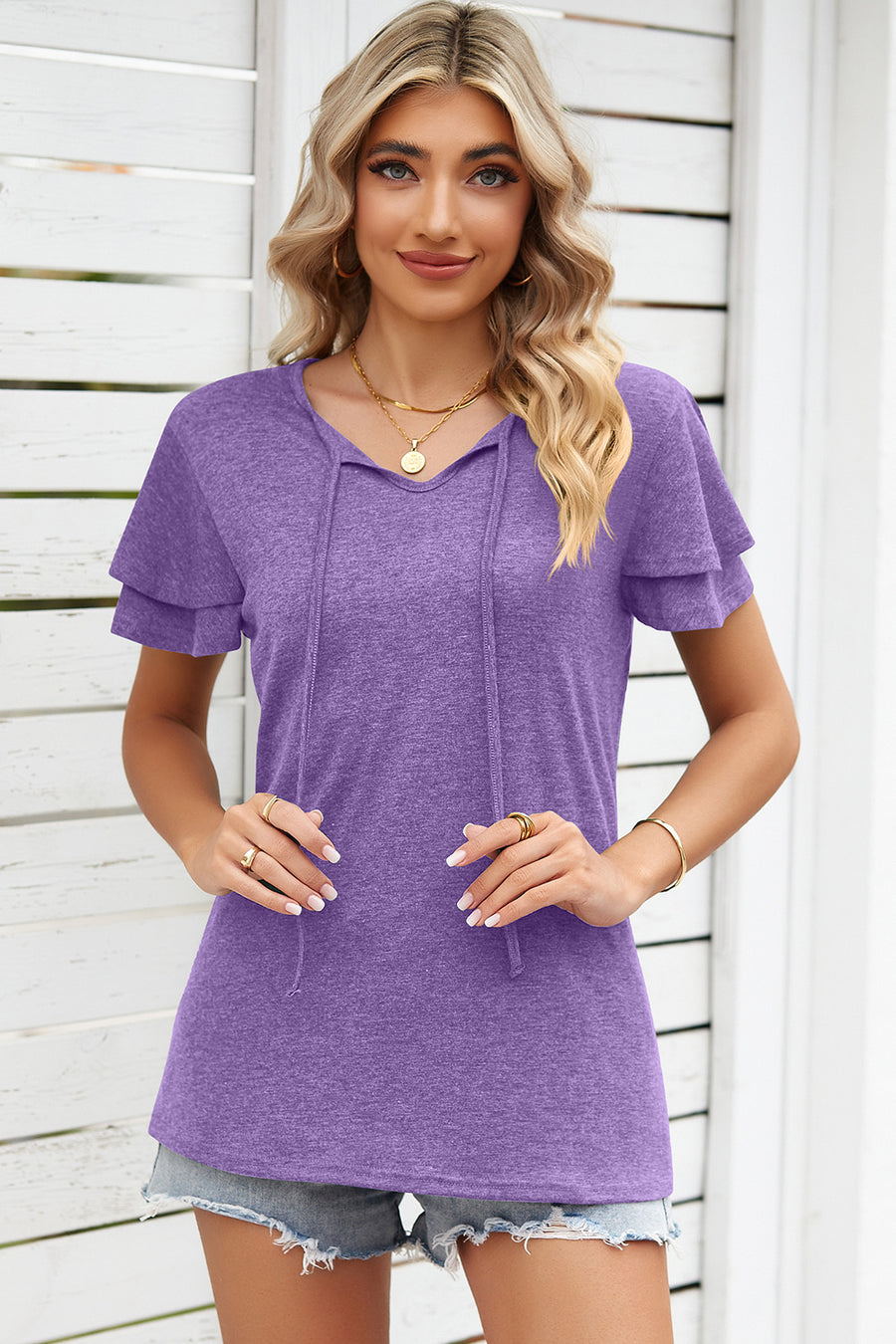 Flutter sleeve henley tee in lavender with tie-neck detail and layered sleeves.