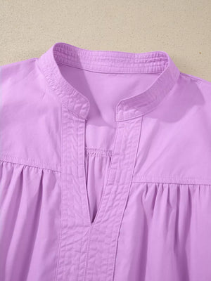 Lavender cotton shirt with notched collar, pintuck details, and gathered yoke.