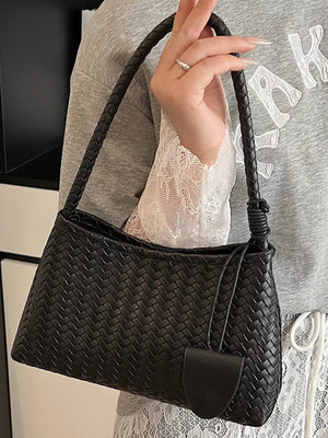 Black woven shoulder bag with braided strap and leather detail