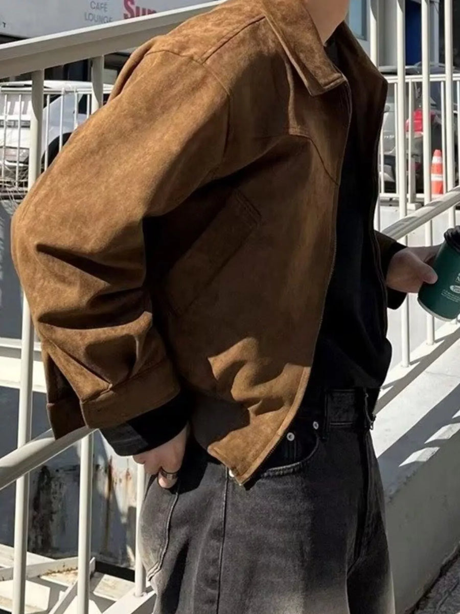 Brown casual zip up jacket with collar and pockets, worn by a man.