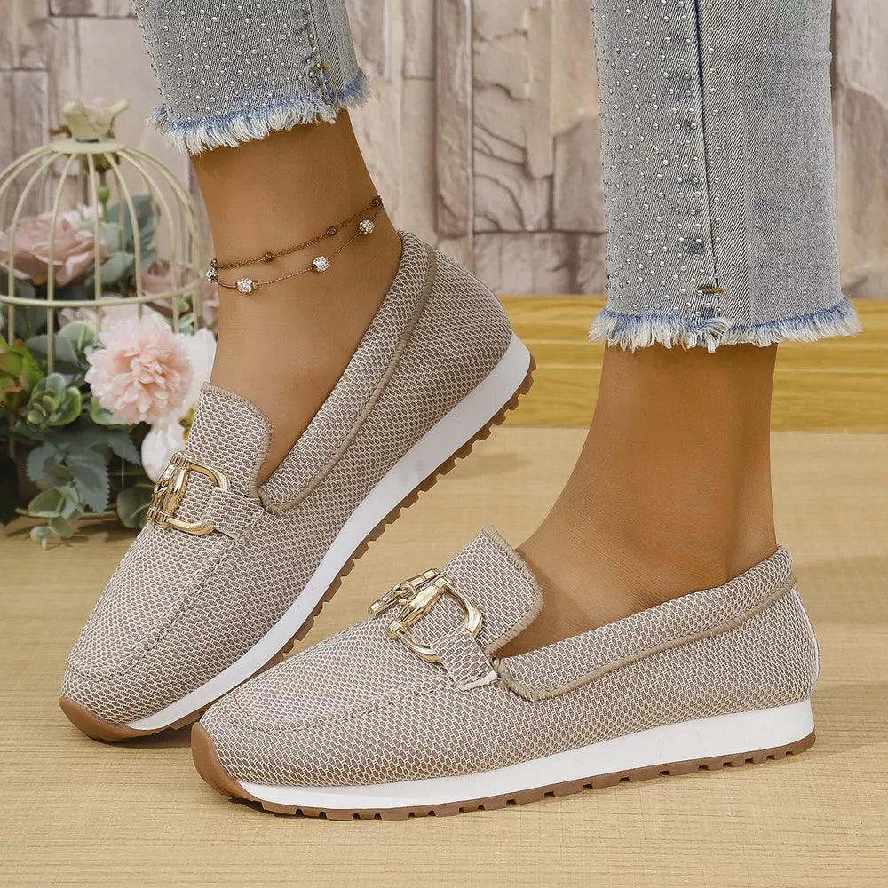 Chic mesh slip-on loafers in khaki with gold buckle detail and white soles.
