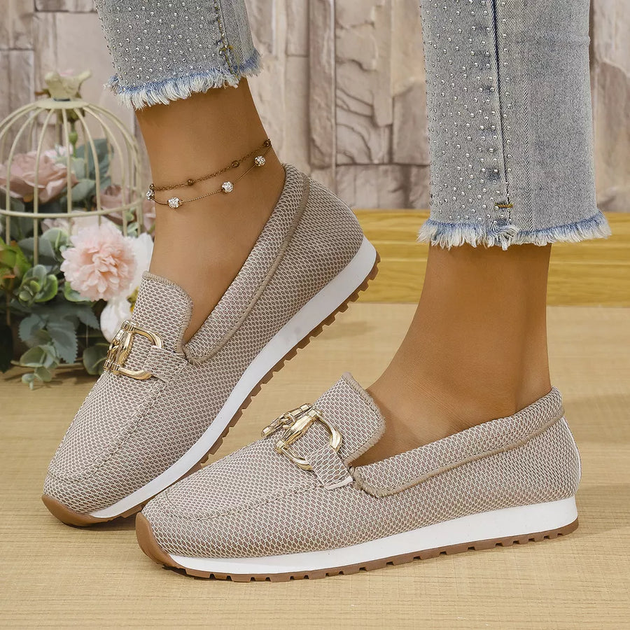 Chic mesh slip-on loafers in khaki with gold buckle detail and white soles.