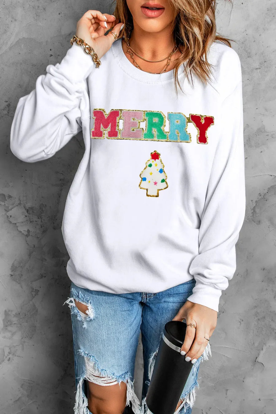 White sweatshirt with MERRY text appliqué and Christmas tree graphic