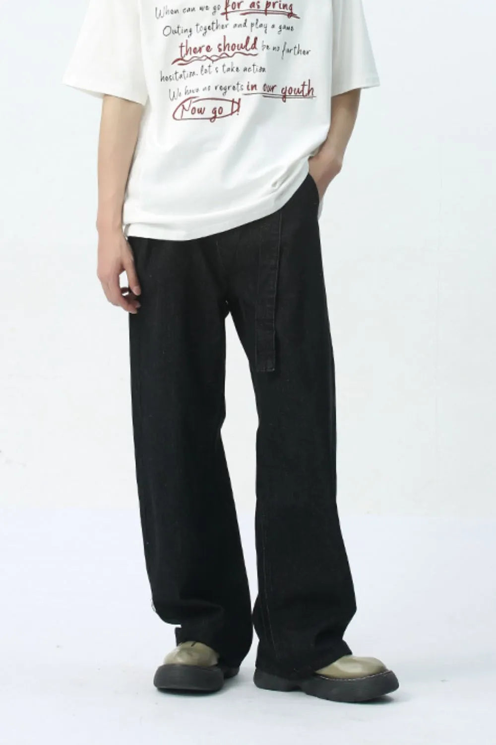 Black wide-leg denim jeans with a belted waist detail