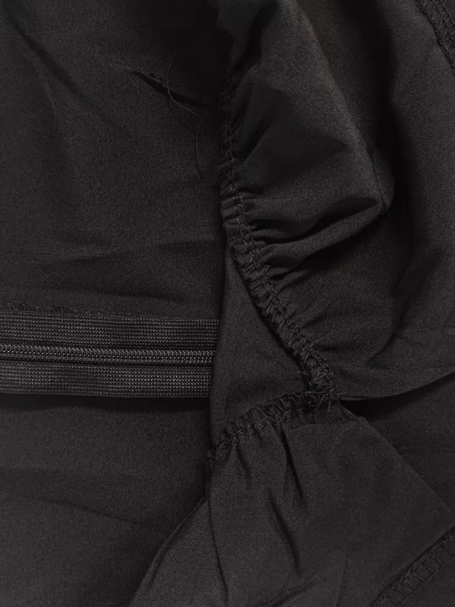 Black midi dress with ruched detail and elastic waistband.