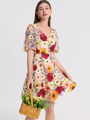 Sheer floral embroidered dress with v-neck and puff sleeves, in a mini length.