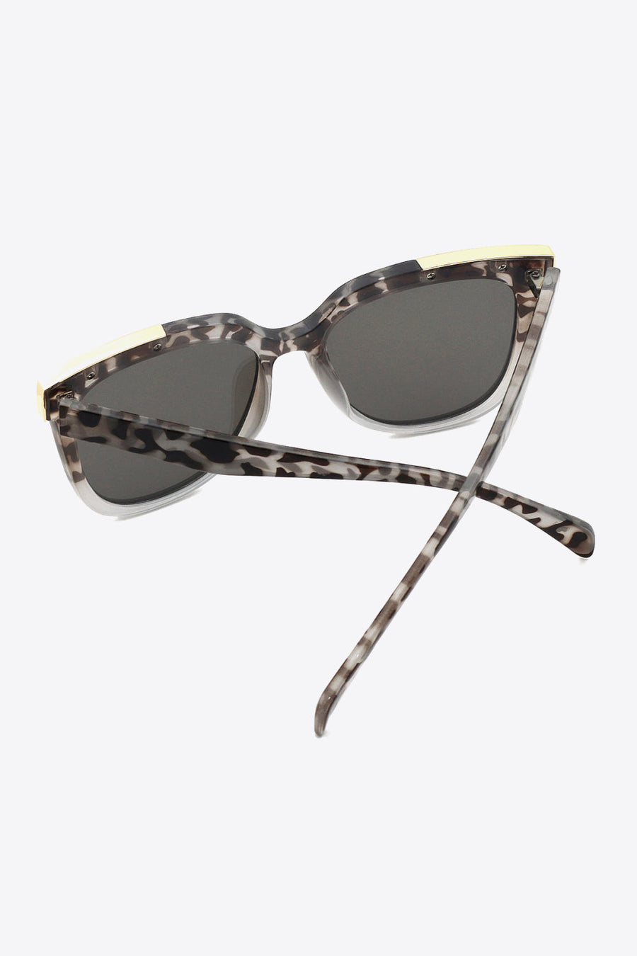 Leopard print angular frame sunglasses with light gray accents and dark lenses.