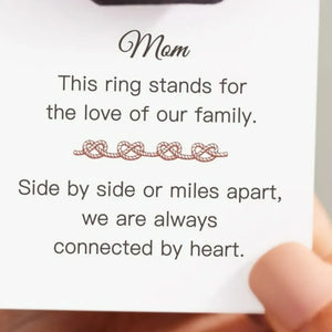 Sterling silver ring with intertwined heart motif, a delicate and classic design.