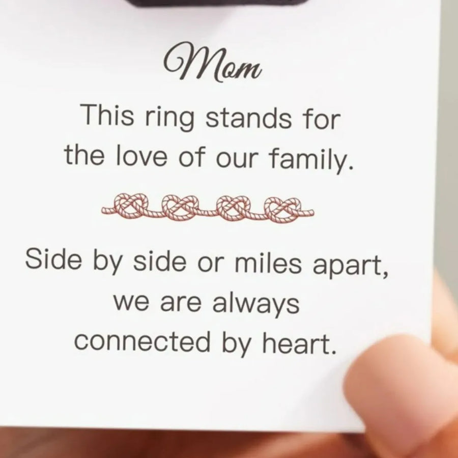 Sterling silver ring with intertwined heart motif, a delicate and classic design.