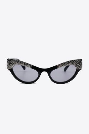 Black cat-eye sunglasses with crystal embellishments on acetate frames