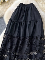 Black tiered skirt with elastic waist and intricate lace hem detail